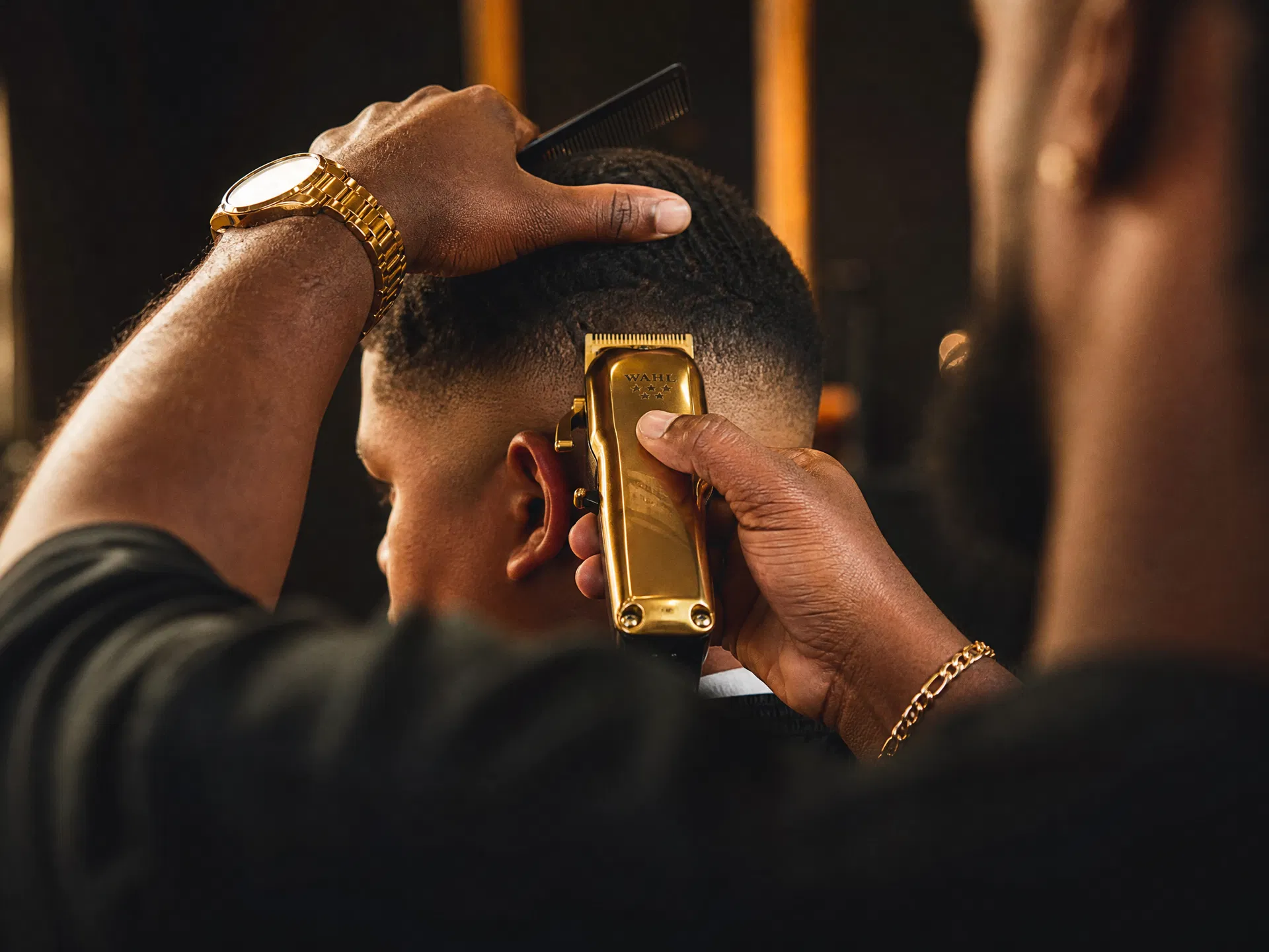 Barber cutting hair with precision clippers